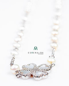 Clover Charm Necklace with white pearl details.